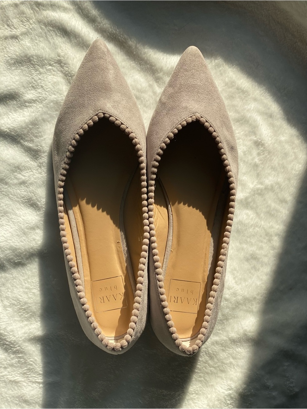 Kaari Blue Taupe Pointed Suede Ballet Flats with Pom-Pom Trim